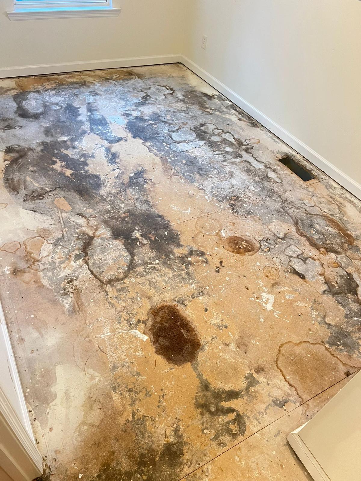 Damaged subfloor before ZAV Flooring's work